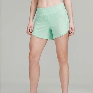 *never worn* lululemon Track That Mid-Rise 5” in Electric Mint; size 4